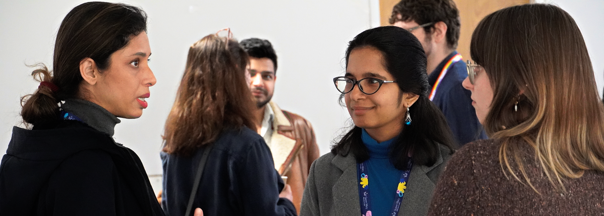 Postgraduate Hub new Landing Page Header Image showing students talking in circle.